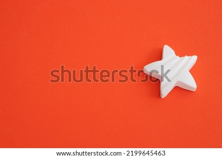 Plaster figure of star on a colored background