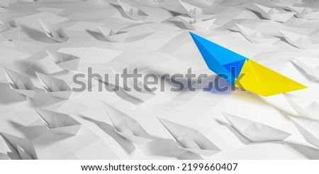 Help for Ukraine concept. Lone paper ship with Ukrainian flag sailing in a sea of other white ships.