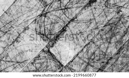Aerial top view texture car skid tire marks on race track, Black tire mark tread marks on race track texture and background.