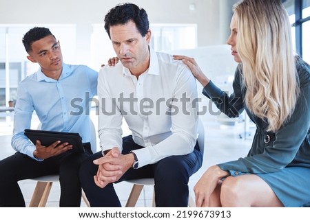 Business, support group and man at the office in depression with supportive colleagues at the workplace. Male employee with mental health problems in divorce, grief or loss with helpful coworkers. Royalty-Free Stock Photo #2199673913