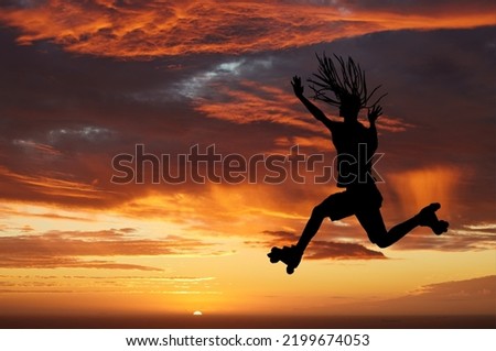 Sunset sky, silhouette and roller skates woman jumping against an orange horizon while enjoying freedom, travel and fun while skating. Energy, scenery and beauty of nature while out on an adventure