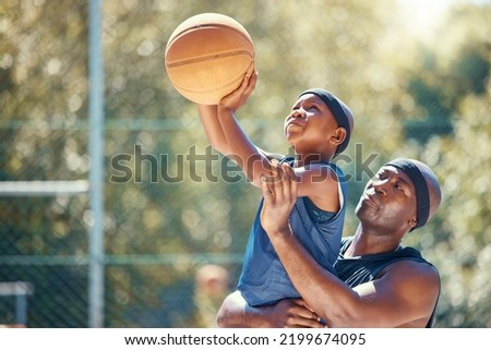 Family basketball, sports father and child, support while training kid in on court in summer, help learning sport game and teaching young athlete. Motivation dad helping African sports person Royalty-Free Stock Photo #2199674095