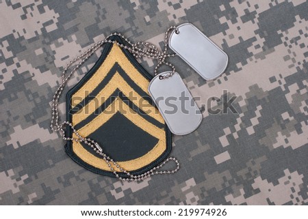 us army uniform with blank dog tags and sergeant rank patch