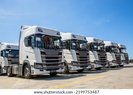 New truck fleet in the parking area Royalty-Free Stock Photo #2199753487