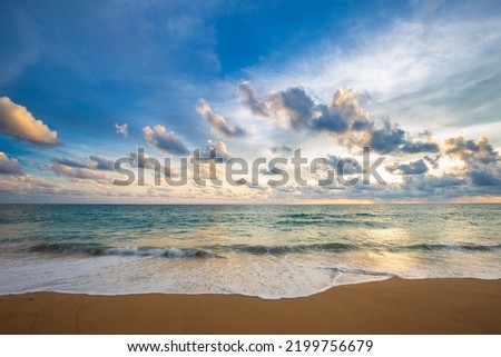 Idyllic sunset sky with cloud on sea beach sand wave exotic summer vacation concept Royalty-Free Stock Photo #2199756679