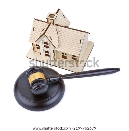 Abstract photo with wooden gavel and abstract house isolated on white background as symbol of sale of mortgage or emergency housing at auction or as symbol of legal dispute over division of real estat Royalty-Free Stock Photo #2199762679