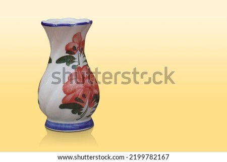 white, blue, green and red color ceramic vase on yellow background, plant, nature, decor, fashion, copy space