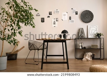 Aesthetic interior of home office interior with design chair, wooden desk, plants, shelf, office accessories, post cards, photos and decoration. Minimalist home decor. Template.	
