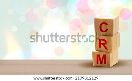 Customer Relationship Management (CRM). Wood cube block stack on the table