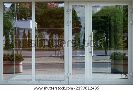 Entrance to a store or office. Gray entrance or office doors