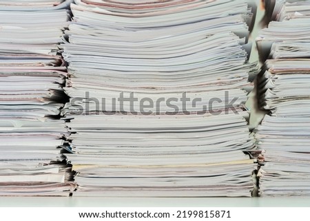 Stack of paper files, close up shot.