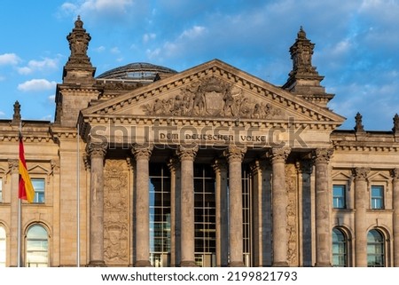 The Reichstag building (Bundestag) in Berlin, Germany, meeting place of the German parliament: The inscription says: Dem Deutschen Volke - To the German people Royalty-Free Stock Photo #2199821793