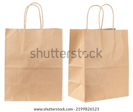 Paper bag. Kraft paper shopping bag. Brown folded paper bag with handle. Empty grocery paper bag. Recycled carton package for supermarket. High quality and resolution photo. Isolated white background. Royalty-Free Stock Photo #2199826523