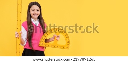 happy kid girl use protractor ruler to learn mathematics, measurement. Banner of schoolgirl student. School child pupil portrait with copy space.