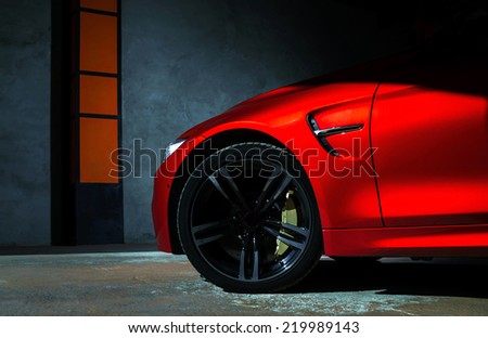 Luxury red car details view, elegant and beautiful Royalty-Free Stock Photo #219989143
