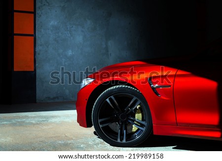 Luxury red car details view, elegant and beautiful Royalty-Free Stock Photo #219989158