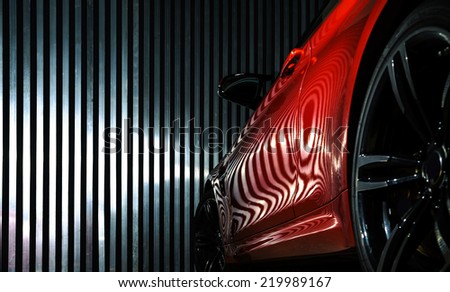 Luxury red car details view, elegant and beautiful Royalty-Free Stock Photo #219989167