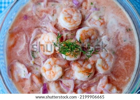 Shrimp ceviche, prepared with cooked shrimp, tomato and onion pieces, lemon and cilantro, served in a glass dish. Royalty-Free Stock Photo #2199906665