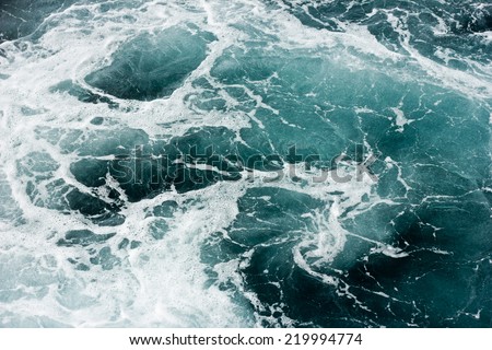 Ocean wave background. Bubble water foam backdrop. Turbulent sea texture. Messy water flow.