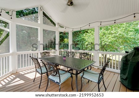 Porch interior screened in patio set Royalty-Free Stock Photo #2199952653