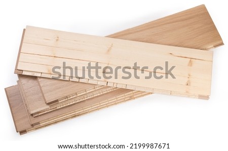 Stack of the three-layer engineered wood flooring boards with white oak face layer, pine core layer and glue-less locking joint system, top board turned face down on a white background
 Royalty-Free Stock Photo #2199987671