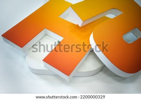 Production of letters in outdoor advertising. Three-dimensional large letters for signage. Production of interior advertising made of plastic. Plastic symbols for advertising. Royalty-Free Stock Photo #2200000329