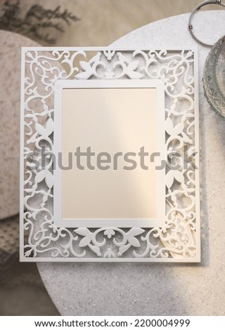 mockup vintage blank photo frame on stone table with sunlight
