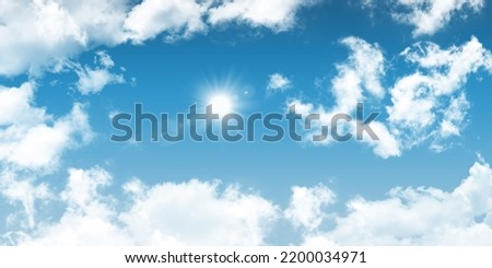 The sun shines through the clouds in the blue sky. 3d ceiling decoration image. Stretch ceiling sky model. Royalty-Free Stock Photo #2200034971