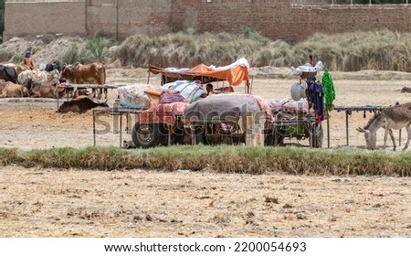 homeless people are staying outside cause of flood  Royalty-Free Stock Photo #2200054693