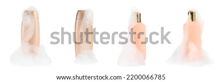 Set with bottles of bubble bath and fluffy foam on white background. Banner design
