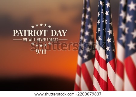 USA flag on sunset sky background. National Day of Prayer and Remembrance for the Victims of the Terrorist Attacks. Patriot Day. Royalty-Free Stock Photo #2200079837