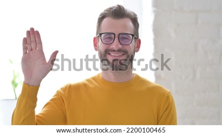 Portrait of Man Saying Hello, Welcoming