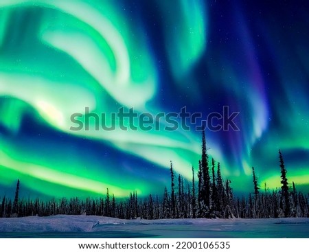 Aurora borealis on the Norway. Green northern lights above mountains. Night sky with polar lights. Night winter landscape with aurora and reflection on the water surface. Natural back Royalty-Free Stock Photo #2200106535
