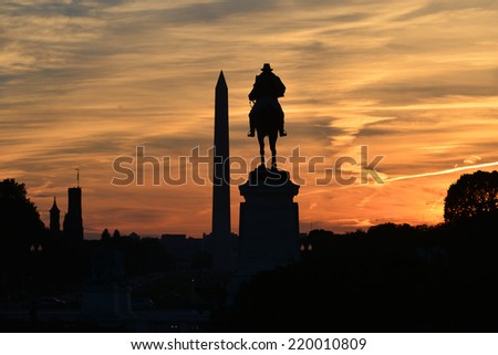 Ulysses S. Grant Memorial and Washington Monument silhouettes in sunset - Washington DC, United States of America