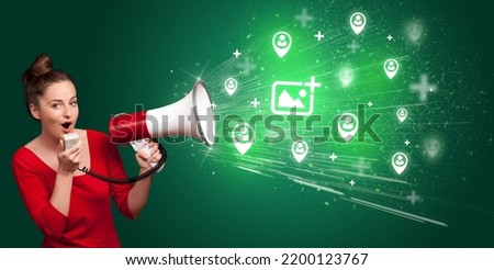 Young person with megaphone and social networking icon