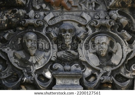 Skull iconography on gravestone in Greyfriars Cemetery in Edinburgh, Scotland