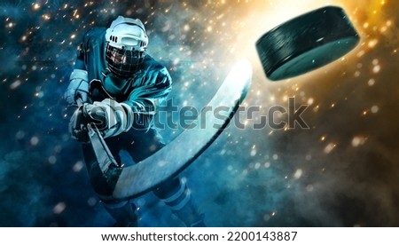 Ice Hockey player athlete in the helmet and gloves on stadium with stick. Action shot. Sport concept.  Sports betting. Bets in the mobile application. Royalty-Free Stock Photo #2200143887