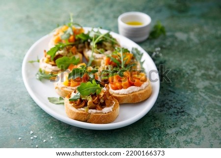 Homemade vegan crostini with vegetables and chanterelle Royalty-Free Stock Photo #2200166373