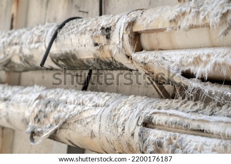 Picture of pipe containing Asbestos Insulation Royalty-Free Stock Photo #2200176187