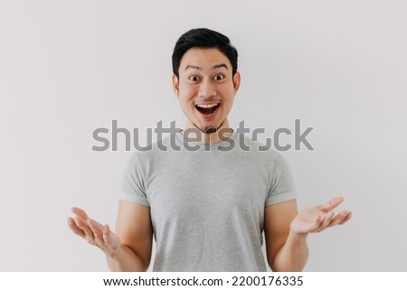 Surprised shocked face asian man isolated on white background for advertisement. Royalty-Free Stock Photo #2200176335