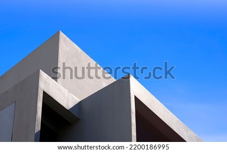 Modern geometric Building against blue Sky in Low Angle and perspective side view, Abstract Architecture background  
