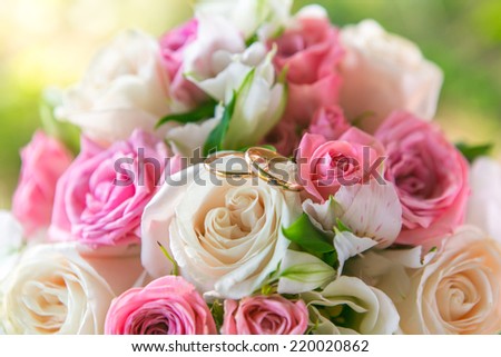 Beautiful wedding bouquet and gold wedding rings