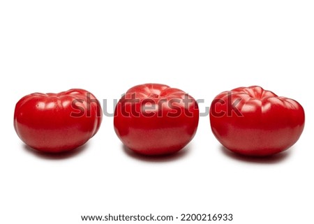 Red fresh tomato isolated on a white background. 
