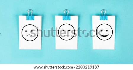 Head with a sad and a happy face, mental health concept, positive and negative mindset, depression, support and evaluation symbol, emotion