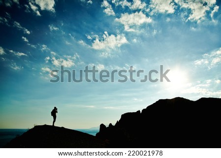 Man silhouette at sunset in mountains. Crimea landscape