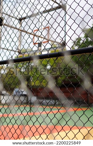 Basketball Hood in the Court with metal mesh around!