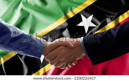 Handshake friendship Saint Kitts and Nevis flag waving Celebration, Beautifully waving flag Close up of flag.