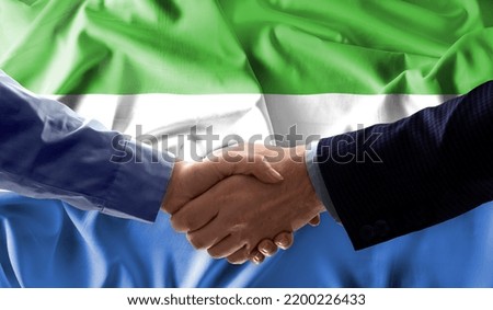 Handshake friendship Sierra Leone flag waving Celebration, Beautifully waving flag Close up of flag.