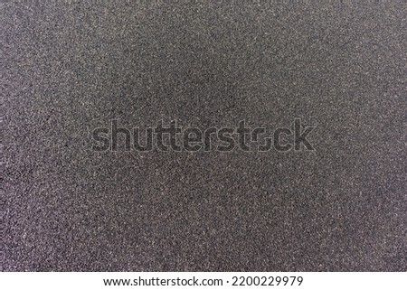 Black and dark gray rubber CBR EPDM granulated coating background on the outdoor sports and kids playground places Royalty-Free Stock Photo #2200229979