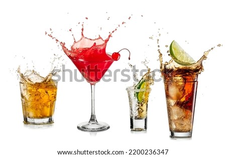 Splash of whiskey, red cherry cocktail, tequila shot and Cuba libre cocktail on white background